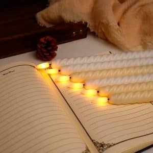 Elegant safe decorative candles with no heat, battery-operated, size 25 cm, creamy color, for lighting homes and occasions