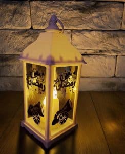 Ramadan decorative lantern on the Iftar table at home